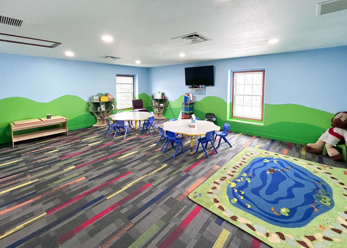 babys feet on white textile