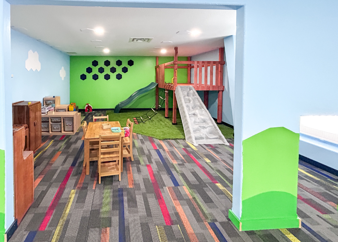 a child is drawing on a piece of paper