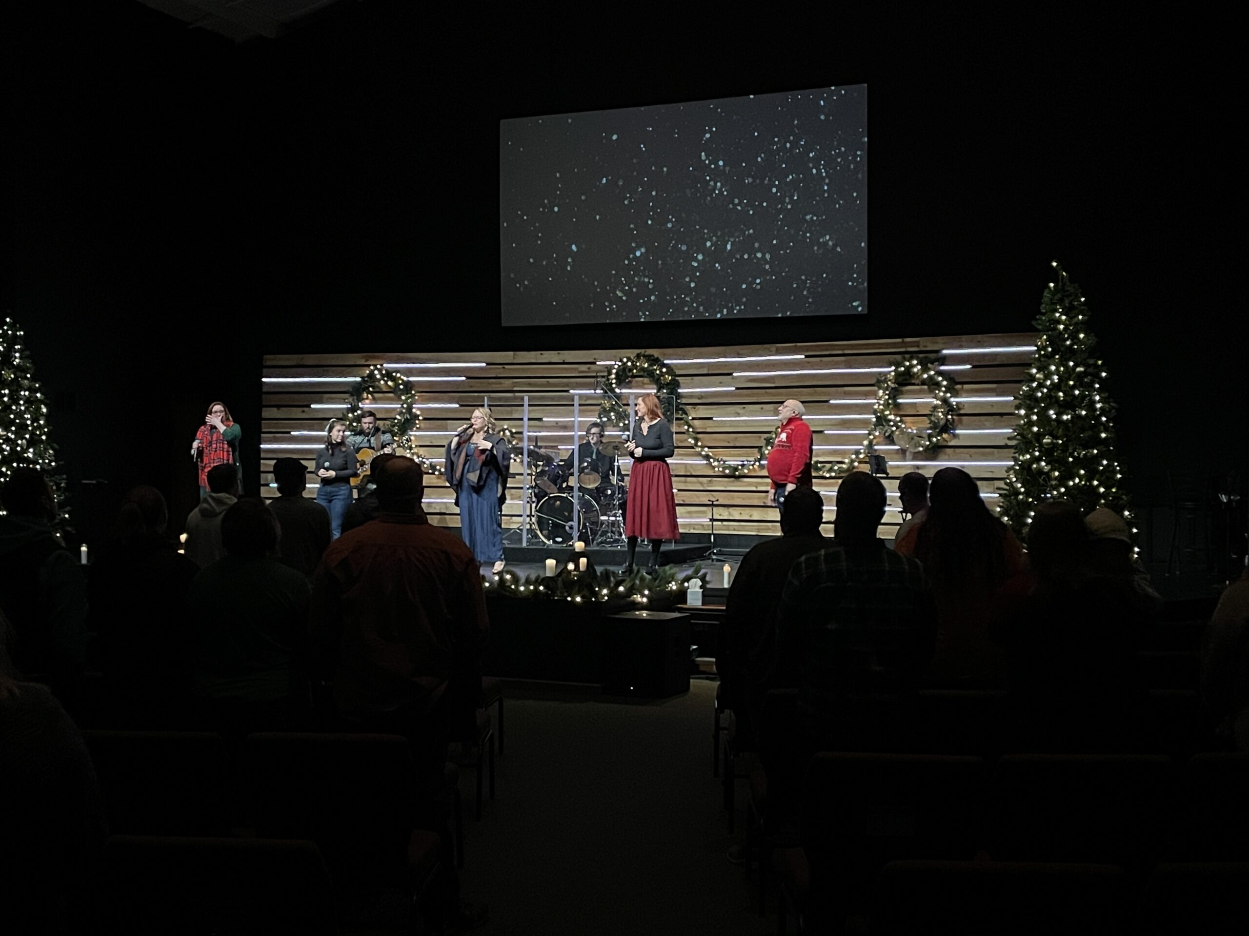 Christmas at gateway angola person raising hand