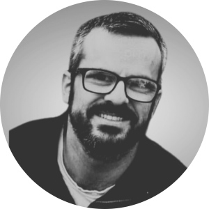 a man wearing a hat and glasses