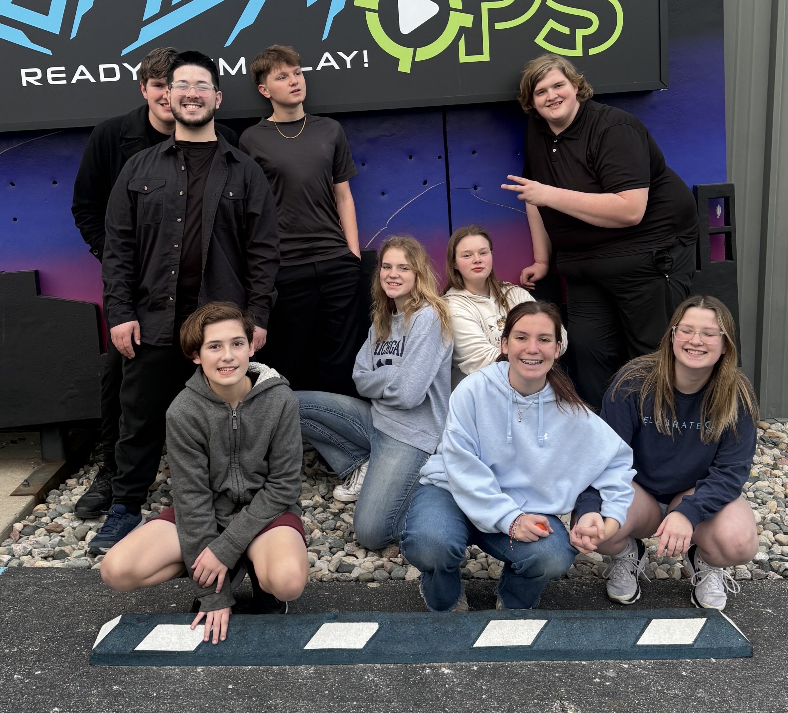 IMG_0913 girl's left hand wrap around toddler while reading book during golden hour